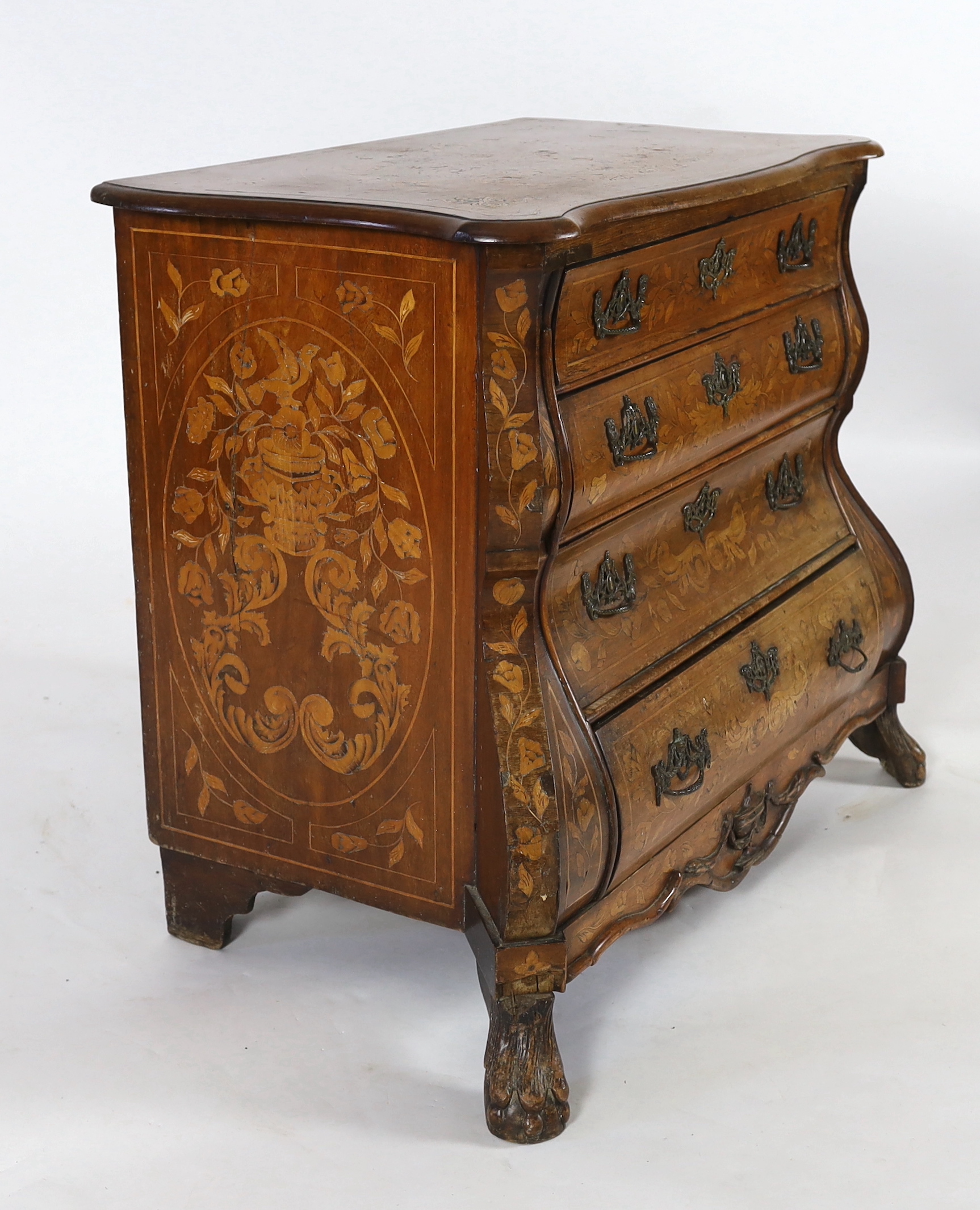 An early 19th century Dutch walnut and marquetry bombé front commode, width 110cm, depth 60cm, height 87cm